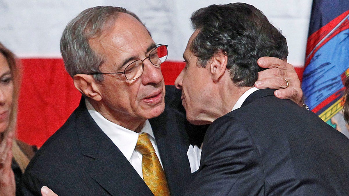 Mario Cuomo, left, embraces son Andrew on election night 2010