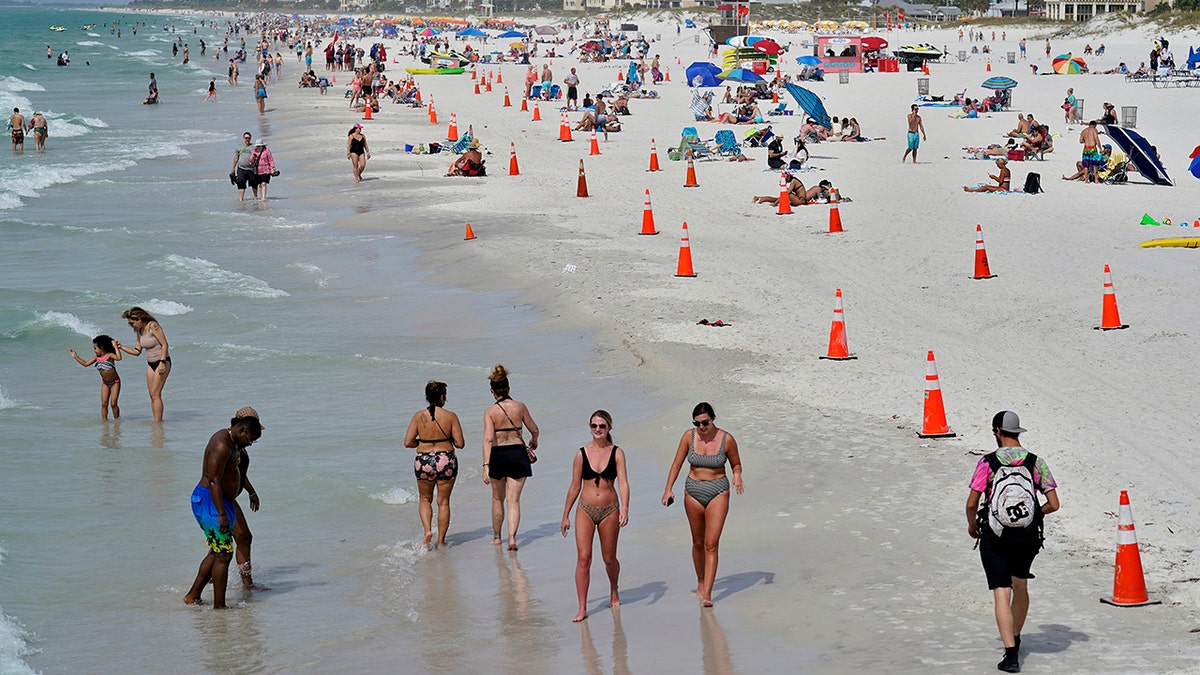 Beachgoers take advantage of the weather as they spend time on Clearwater Beach in this photo from March 2, 2021, in Clearwater, Fla., a popular spring break destination, west of Tampa. 