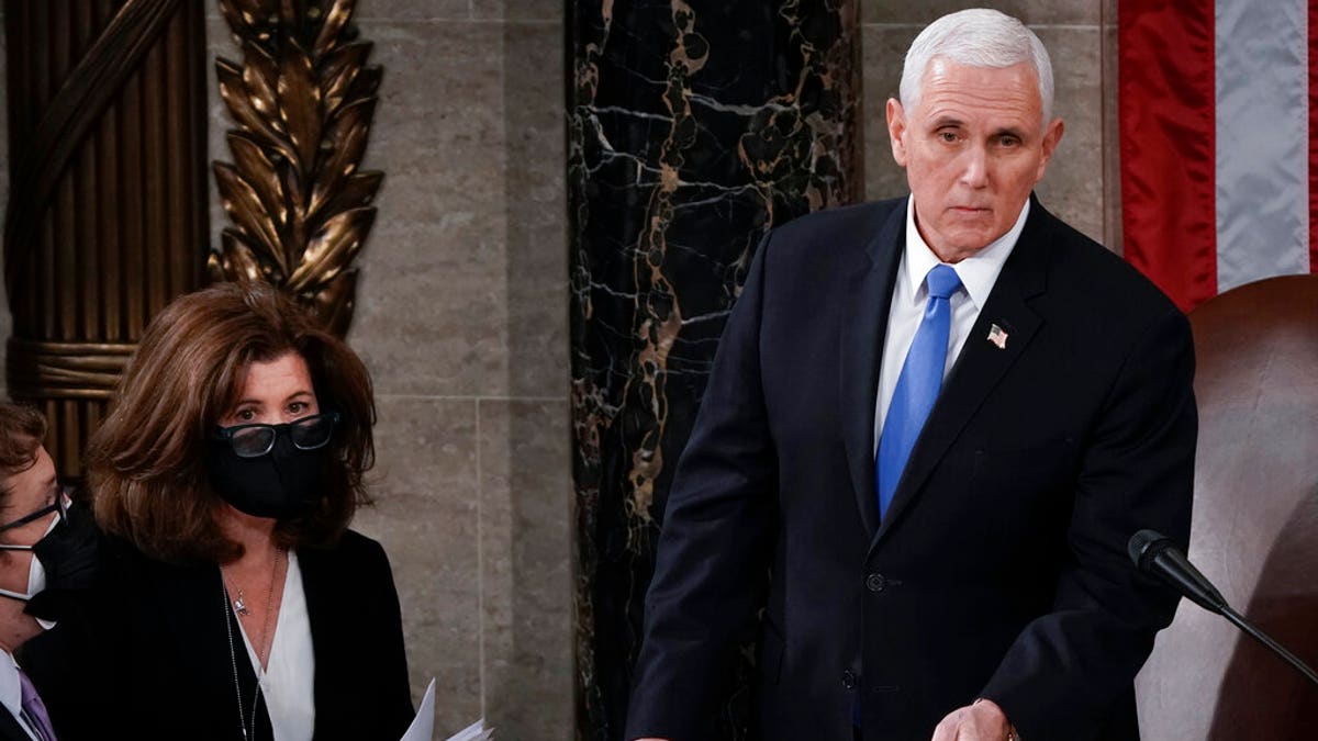 Vice President Mike Pence is in the Capitol during the certification of Electoral College ballots in the presidential election, (AP Photo/J. Scott Applewhite)