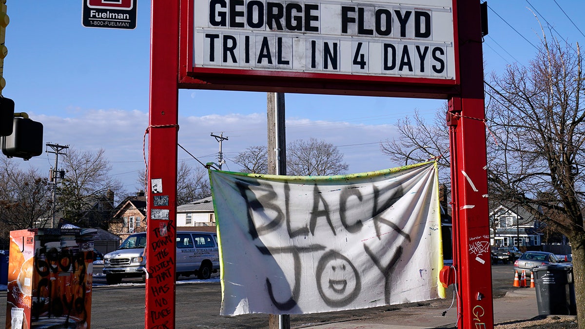 A trial countdown sign marks the days at George Floyd Square, March 4, 2021, in Minneapolis. (AP Photo/Jim Mone)
