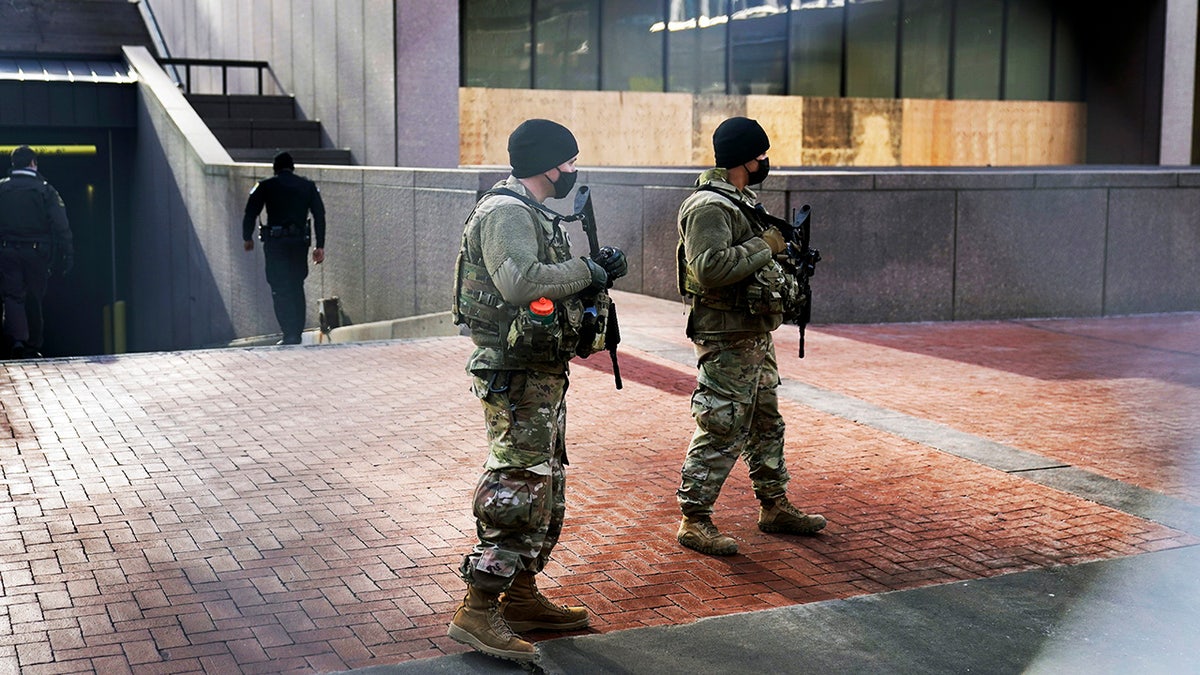 National Guard soldiers maintain security near the loading dock of the barricaded Hennepin County Government Center, Tuesday, March 9, 2021, in Minneapolis where the trial for former Minneapolis police officer Derek Chauvin continues with jury selection. Chauvin is charged with murder in the death of George Floyd during an arrest last may in Minneapolis. (AP Photo/Jim Mone)