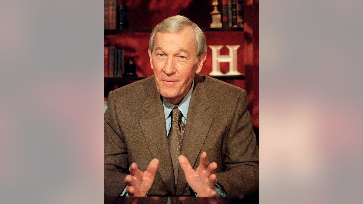 FILE - In this Aug. 6, 2001, file photo, veteran journalist Roger Mudd tapes a segment for the History Channel at CBS studios in New York. Mudd, the longtime political correspondent and anchor for NBC and CBS who once stumped Sen. Edward Kennedy by simply asking why he wanted to be president, died Tuesday, March 9, 2021. He was 93. (AP Photo/Marty Lederhandler, File)