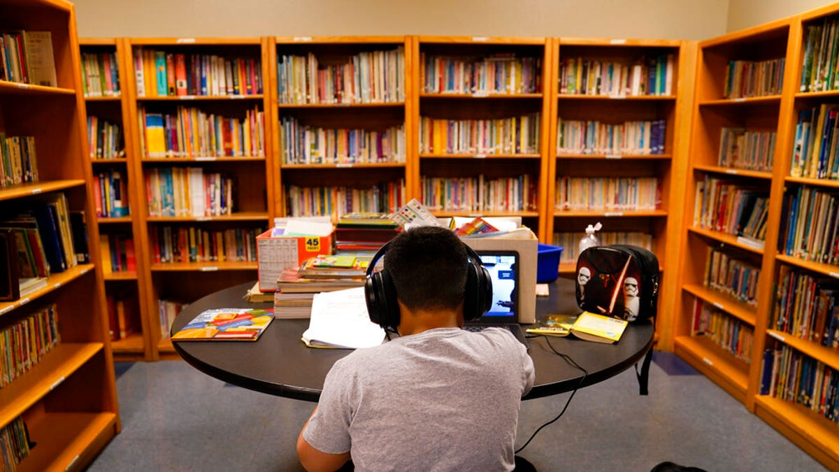 A Los Angeles Unified School District student attends an online class at the Boys &amp; Girls Club of Hollywood in Los Angeles. 