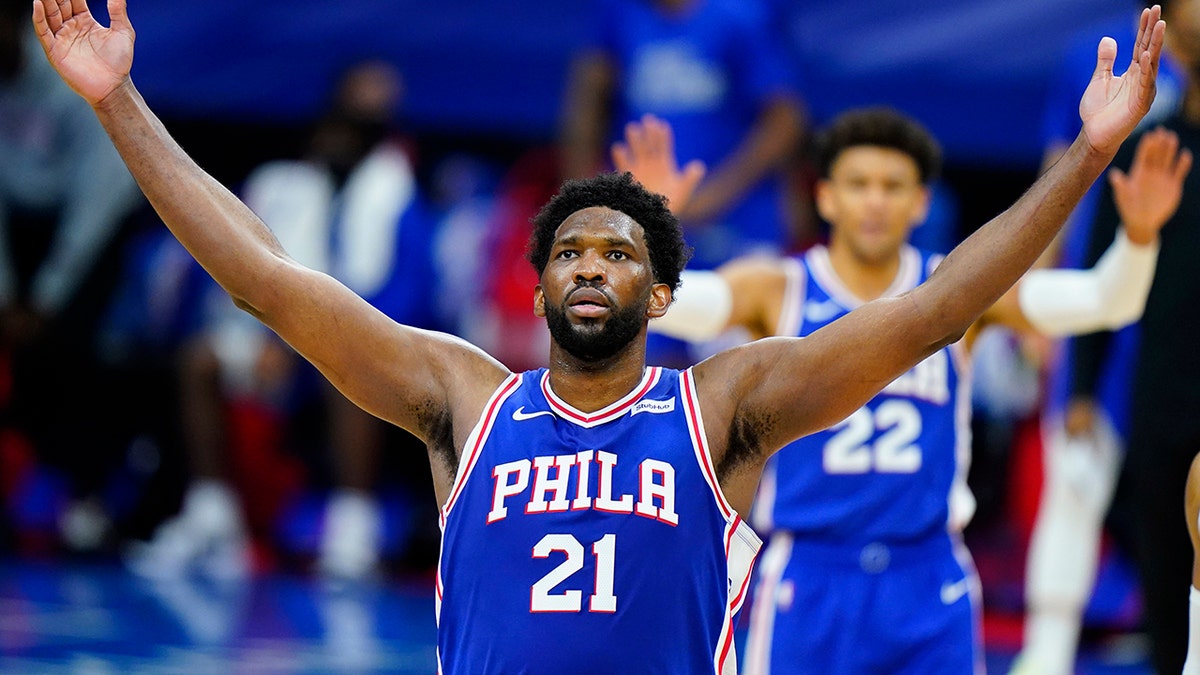 Joel Embiid reacts after making a basket