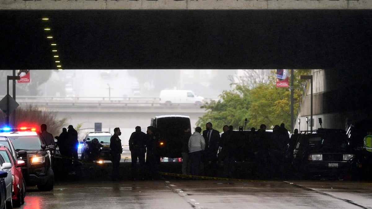 Emergency crews work at the scene of a deadly accident Monday in San Diego. A driver plowed through a crowd on a sidewalk in downtown San Diego on Monday morning, killing three people and injuring six others, including two who are hospitalized in critical condition, police said. (AP Photo/Gregory Bull)