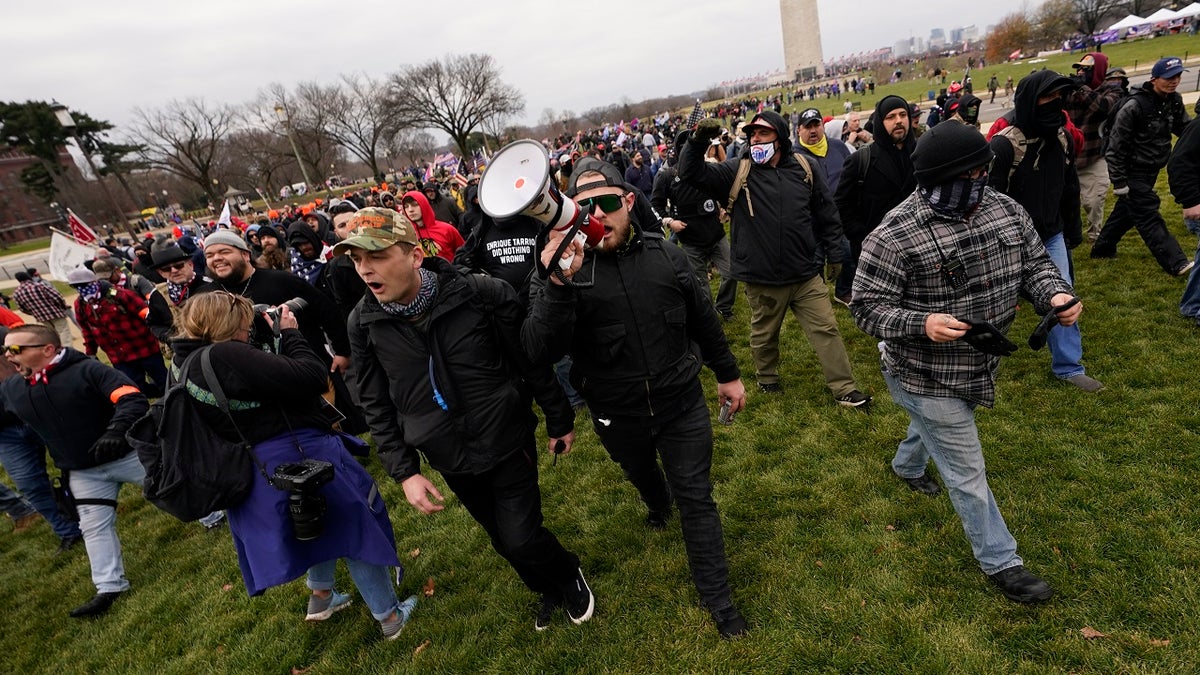 In this Jan. 6, 2021, file photo, people march as they attend a rally in Washington in support of President Trump. White supremacist propaganda reached alarming levels across the U.S. in 2020, according to a new report that the Anti-Defamation League shared with The Associated Press. (AP Photo/Carolyn Kaster, File)