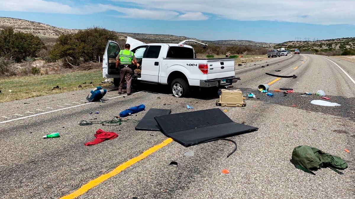 Debris is strewn across a road near the border city of Del Rio, Texas after a collision Monday, March 15, 2021. (Texas Department of Public Safety via AP)
