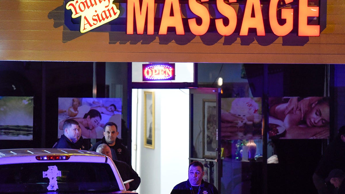 Authorities investigate a fatal shooting at a massage parlor, late Tuesday, March 16, 2021, in Acworth, Ga. Officials say 21-year-old Robert Aaron Long, of Woodstock, Georgia, has been captured hours after multiple people were killed in shootings at three Atlanta-area massage parlors. (AP Photo/Mike Stewart)