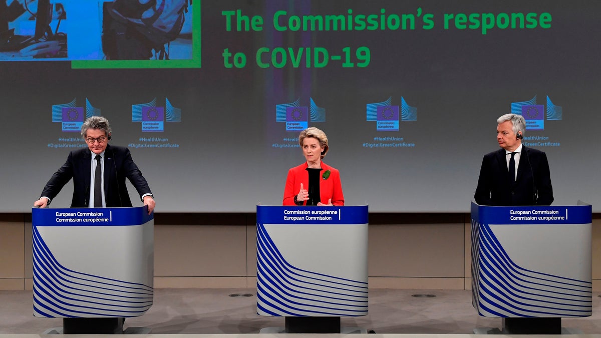 European Commission President Ursula von der Leyen, center, European Commissioner for Internal Market Thierry Breton, left, and European Commissioner for Justice Didier Reynders participate in a media conference on the Commissions response to the coronavirus on March 17, 2021. (John Thys, Pool via AP)