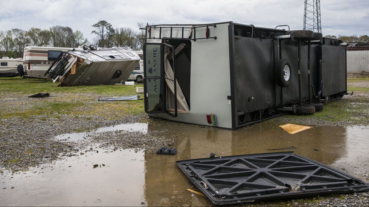 AMU RV service and repair on Old Greensboro Road was struck by a tornado that destroyed multiple client-owned recreational vehicles, Wednesday, March 17, 2021, in Moundville, Ala. The tornado also tore the roof off the workshop with people inside, who survived. A wave of storms is pounding the Deep South, leaving a trail of splintered trees and damaged buildings. And forecasters said still more severe weather was on the way Wednesday with the potential for massive tornadoes, downpours and hail the size of tennis balls. (AP Photo/Vasha Hunt)