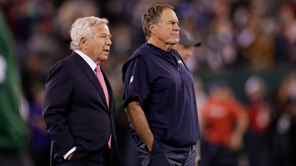 New England Patriots owner Robert Kraft, left, talks to head coach Bill Belichick as their team warms up before an NFL football game against the New York Jets in East Rutherford, N.J., in this Oct. 21, 2019, file photo.