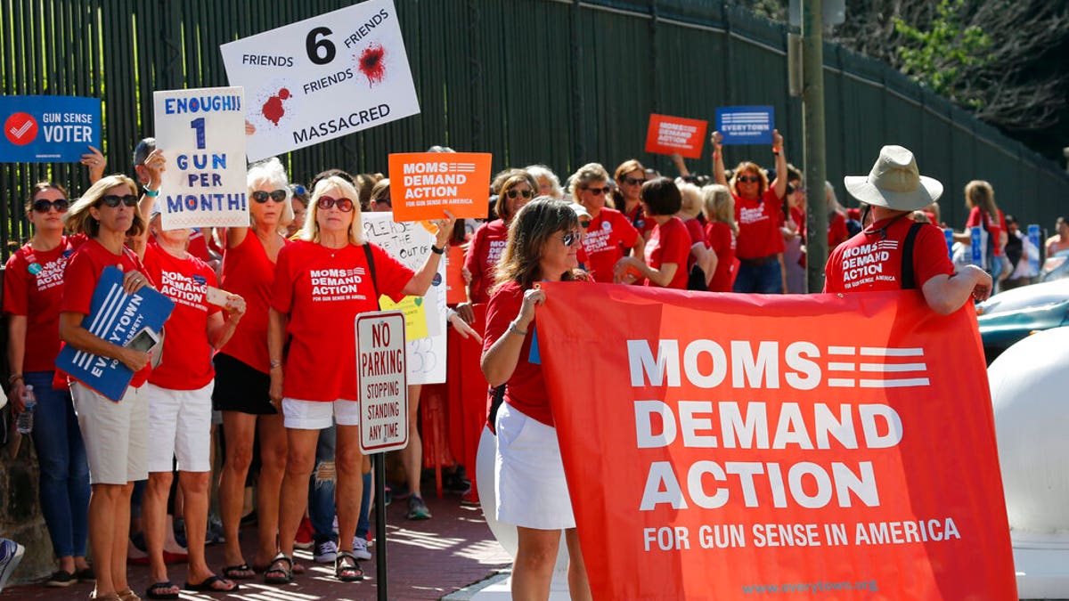 Moms Demanding Action line up during a rally at the State Capitol in Richmond, Virginia. 