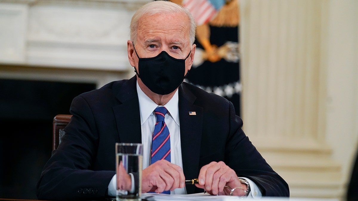 President Joe Biden meets with Vice President Kamala Harris, Health and Human Services Secretary Xavier Becerra and Homeland Security Secretary Alejandro Mayorkas in the State Dining Room of the White House, Wednesday, March 24, 2021, in Washington. (AP Photo/Evan Vucci)