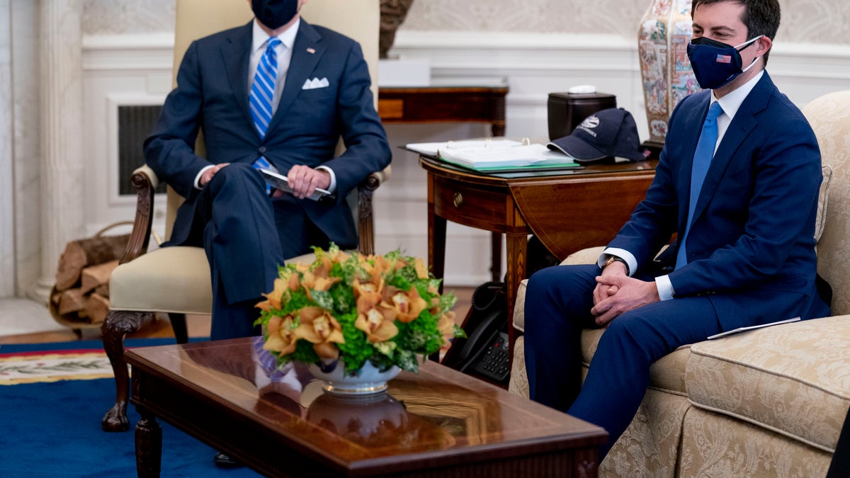 President Joe Biden and Transportation Secretary Pete Buttigieg. (AP Photo/Andrew Harnik, File)