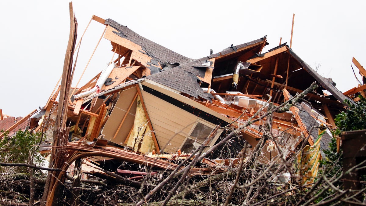A house is totally destroyed after a tornado touches down south of Birmingham, Ala. in the Eagle Point community damaging multiple homes, Thursday, March 25, 2021. 