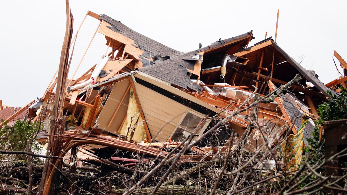 A house is totally destroyed after a tornado touches down south of Birmingham, Ala. in the Eagle Point community damaging multiple homes, Thursday, March 25, 2021.