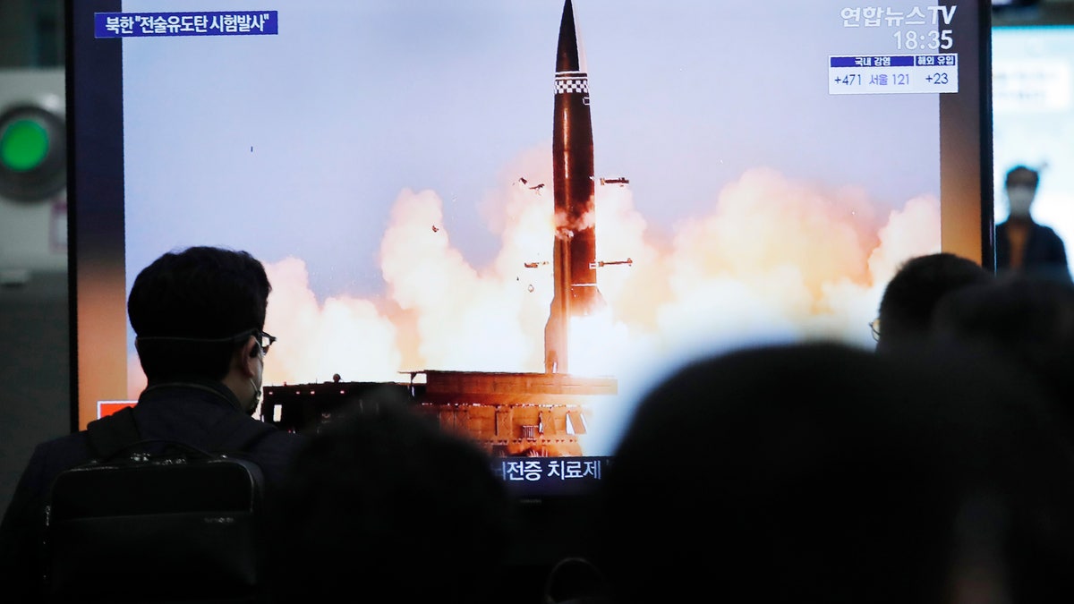 People watch a TV showing an image of North Korea's new guided missile during a news program at the Suseo Railway Station in Seoul, South Korea, Friday. March 26, 2021. In resuming its ballistic testing activity after a yearlong pause, North Korea has demonstrated a potentially nuclear-capable weapon that shows how it continues to expand its military capabilities amid a stalemate in diplomacy with the United States. (AP Photo/Ahn Young-joon)