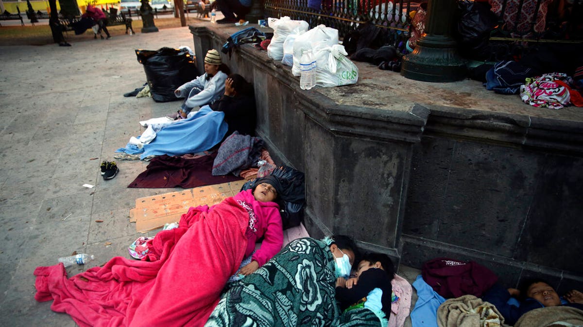 Migrants sleep under a gazebo at a park in the Mexican border city of Reynosa, Saturday, March 27, 2021. 