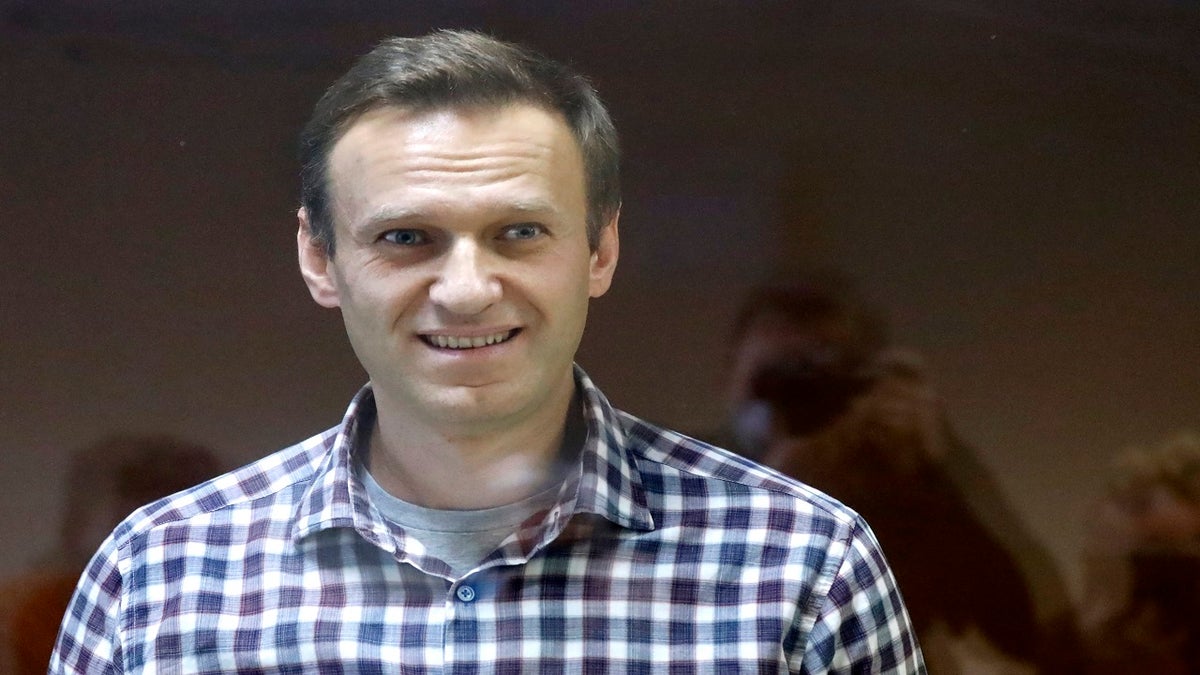 Russian opposition leader Alexei Navalny stands in a cage in the Babuskinsky District Court in Moscow, Russia, on Feb 20. (AP)