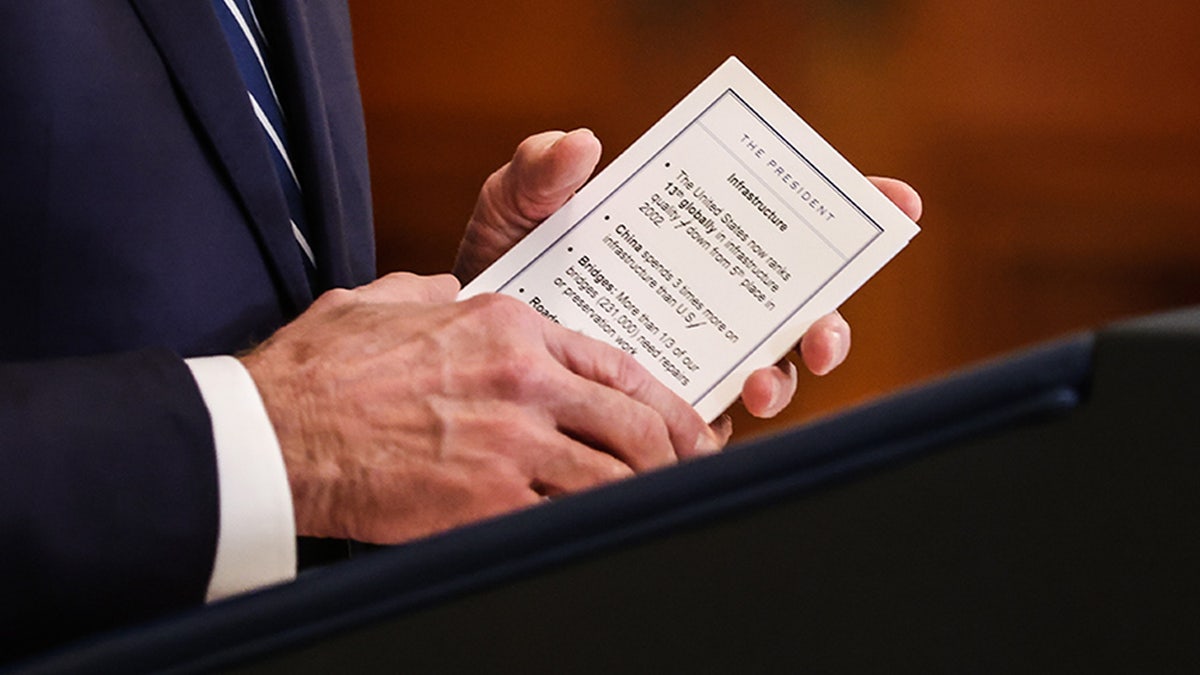 Biden holding notes