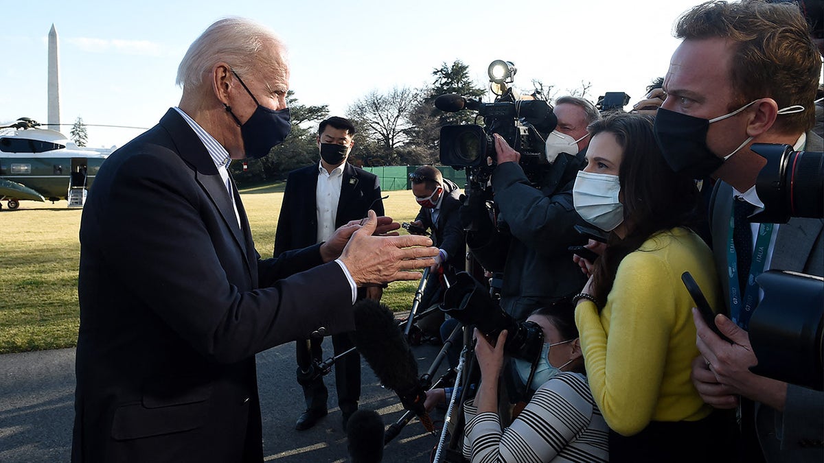 US President Joe Biden talks briefly with reporters upon his return from Camp David, Maryland to the White House in Washington, DC on March 21, 2021. (Photo by OLIVIER DOULIERY / AFP) (Photo by OLIVIER DOULIERY/AFP via Getty Images)