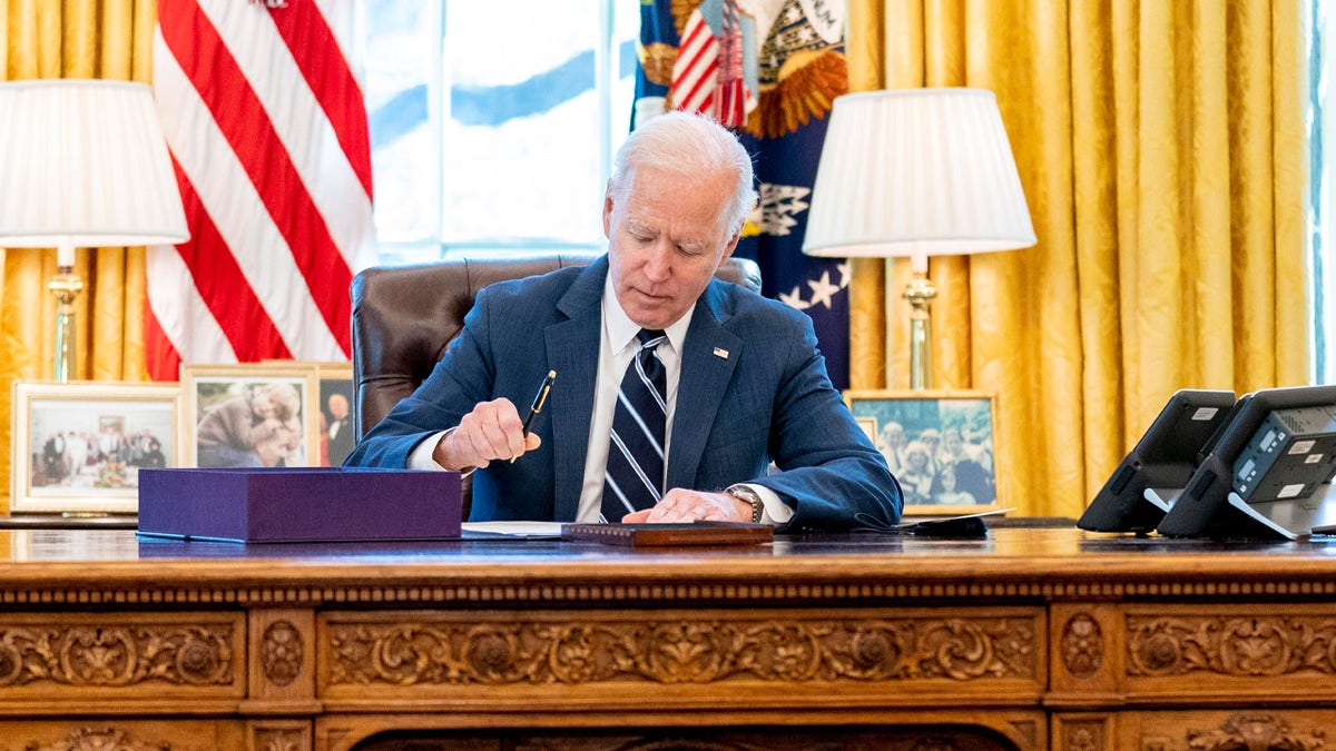 President Joe Biden signs the American Rescue Plan