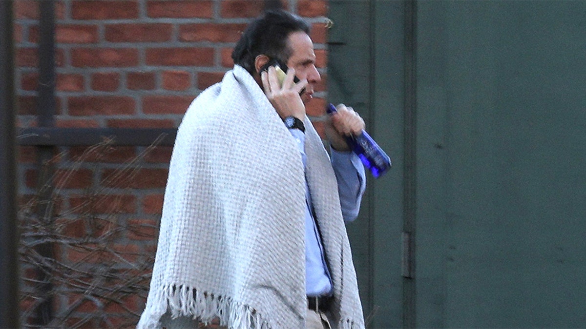 New York Governor, Andrew Cuomo, walks on the grounds of the Governor's Mansion following allegations that he had sexually harassed young women, in Albany, New York, U.S., March 12, 2021.