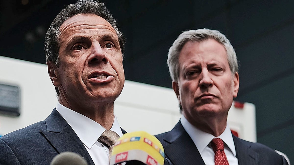 Governor of New York Andrew Cuomo stands with New York City Mayor Bill de Blasio at a news conference at the Time Warner Center after an explosive device was found this morning on October 24, 2018 in New York City. (Photo by Spencer Platt/Getty Images)