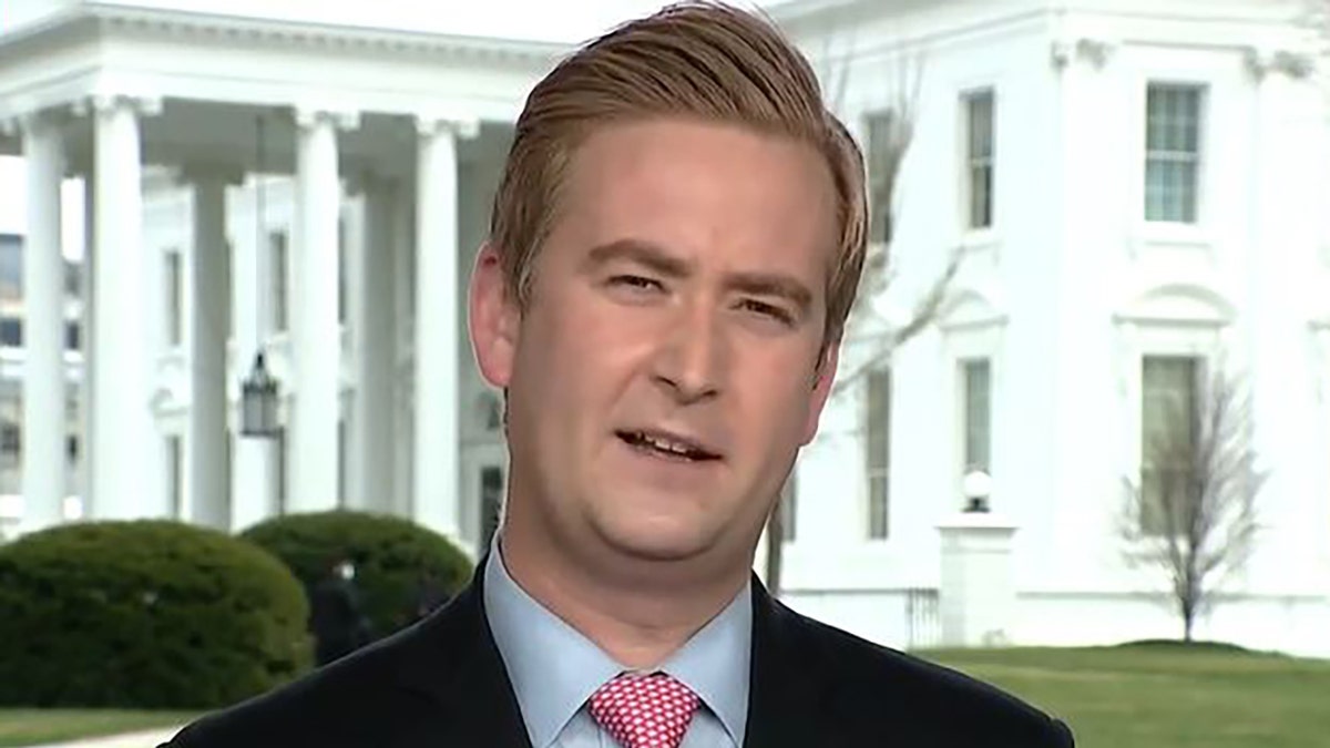Peter Doocy standing in front of White House