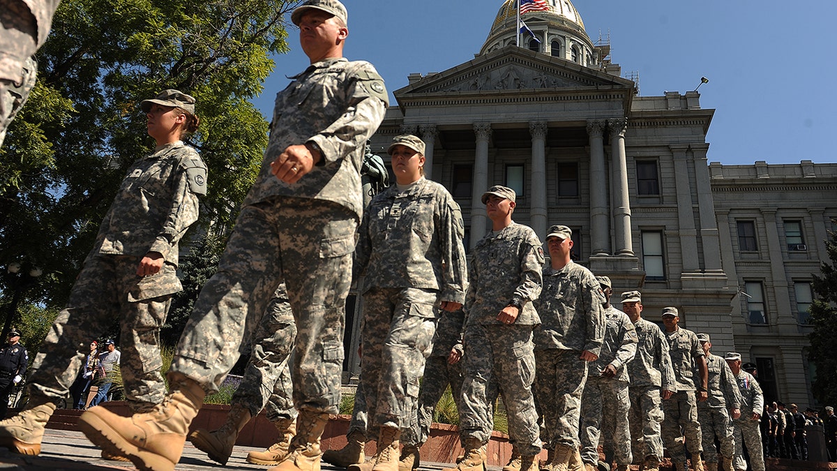 Members of the Colorado National Guard Honor Guard are seen here in September 2011. Colorado is activating the Guard this weekend ahead of a looming major winter storm. (The Denver Post via Getty Images)