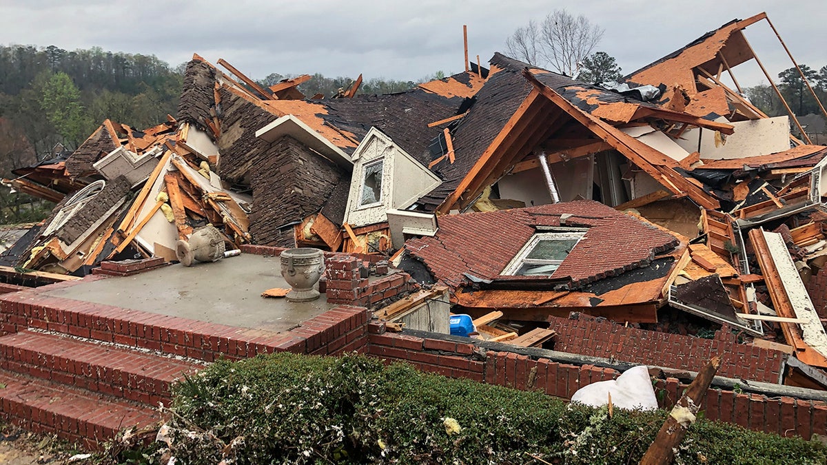 Damage is seen to a home after a tornado passed through the Eagle Point subdivision, Thursday, March 25, 2021, near Birmingham, Ala. Authorities reported major tornado damage Thursday south of Birmingham as strong storms moved through the state. The governor issued an emergency declaration as meteorologists warned that more twisters were likely on their way. (AP Photo/Butch Dill)