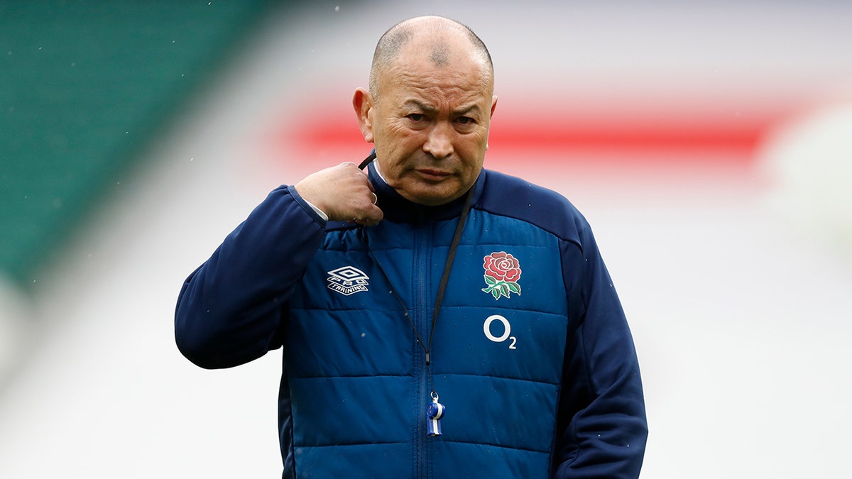 England's head coach Eddie Jones watches his players warm up before the Six Nations rugby union match between England and France at Twickenham Stadium, London, Saturday, March 13, 2021. (AP Photo/Alastair Grant)