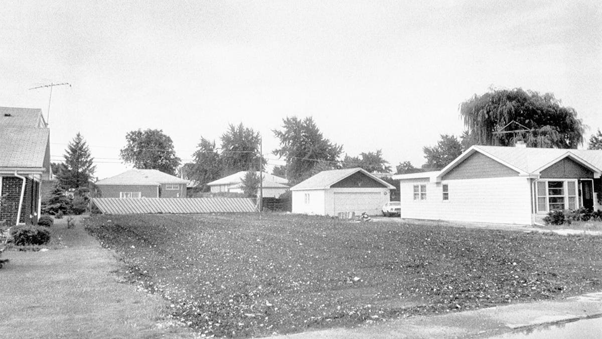 A barren plot of land is an uncomfortable reminder of the "house of horrors" home of John Wayne Gacy that once stood there. 