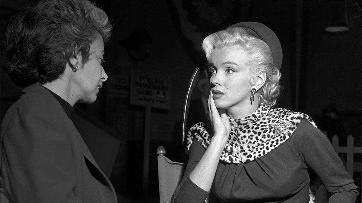 Actress Marilyn Monroe and her acting coach Natasha Lytess on the set of the film "Gentlemen Prefer Blondes' in December 1952 in Los Angeles, California.