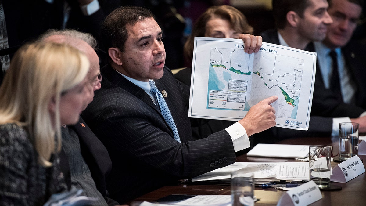 WASHINGTON, DC - JANUARY 9: Rep. Henry Cuellar, D-Texas, hold up a border map as he speaks during a meeting with lawmakers on immigration policy in the Cabinet Room at the White House in Washington, DC on Tuesday, Jan. 09, 2018. (Photo by Jabin Botsford/The Washington Post via Getty Images)