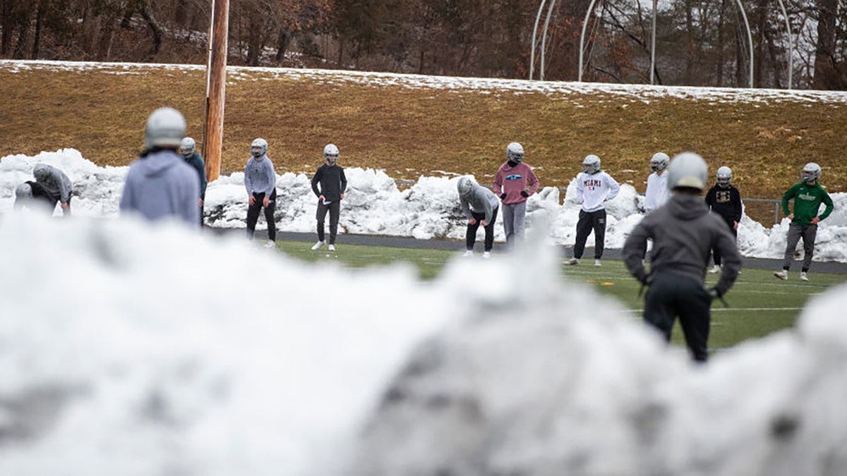 Football practice at Duxbury High School in Duxbury, MA on Feb. 22, 2021. (Photo by Stan Grossfeld/The Boston Globe via Getty Images)