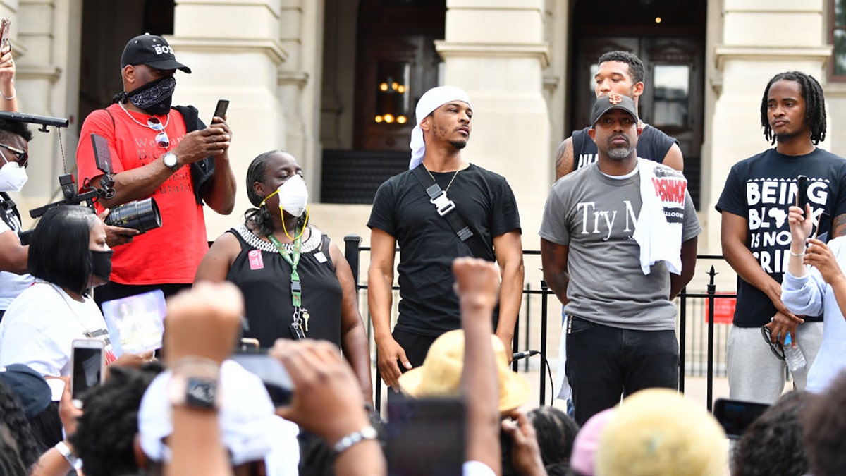 Rapper T.I. says he was arrested in Amsterdam for using a cell phone while bike riding. Photographed here back in June, the rapper attends the Justice For Kendrick Johnson Rally at the Georgia State Capitol on June 13, 2020 in Atlanta, Georgia. 