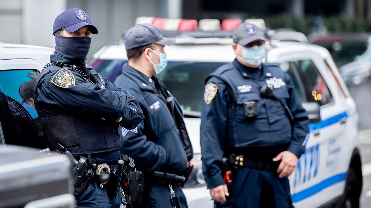 NYPD officers wear masks in Times Square.