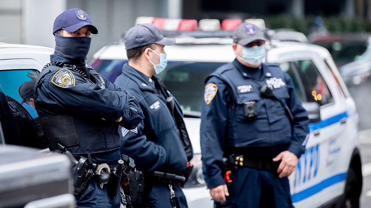 NYPD officers wear masks in Times Square. 