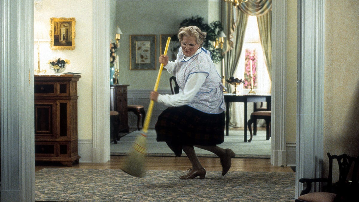 Robin Williams sweeps in a scene from the film 'Mrs. Doubtfire', 1993.