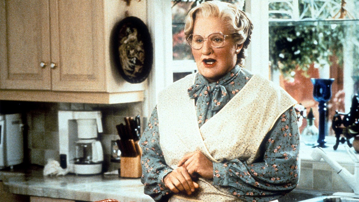 Robin Williams in the kitchen in a scene from the film 'Mrs. Doubtfire', 1993.