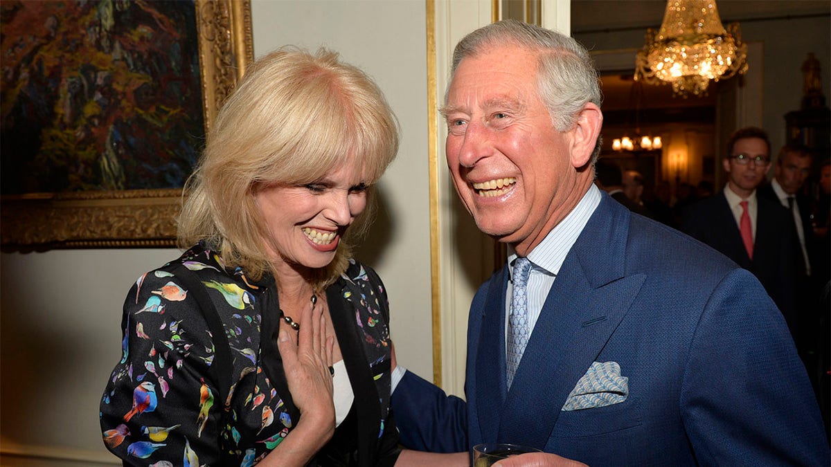Prince Charles, Prince of Wales greets actress Joanna Lumley as he hosts a reception to mark the 60th anniversary of the charity 'Samaritans', at Clarence House on May 1, 2013, in London.