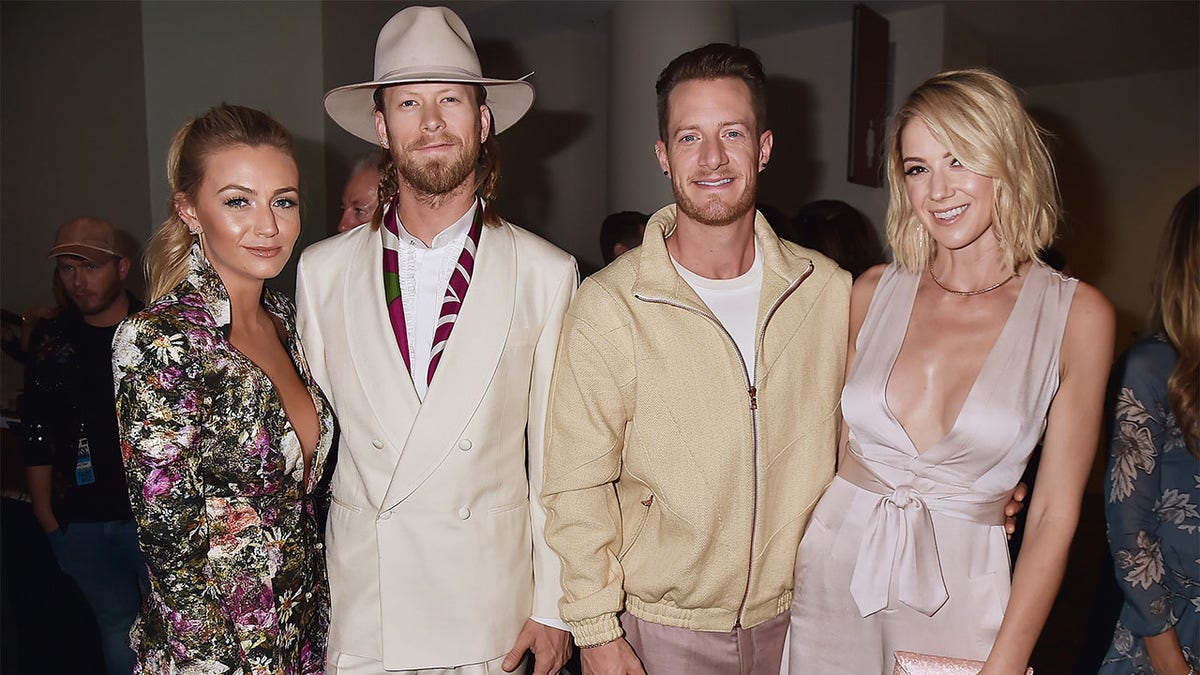 (L-R) Brittney Kelley, Brian Kelley and Tyler Hubbard of Florida Georgia Line, and Hayley Hubbard attend the 2017 CMT Music Awards at the Music City Center on June 7, 2017, in Nashville, Tennessee.