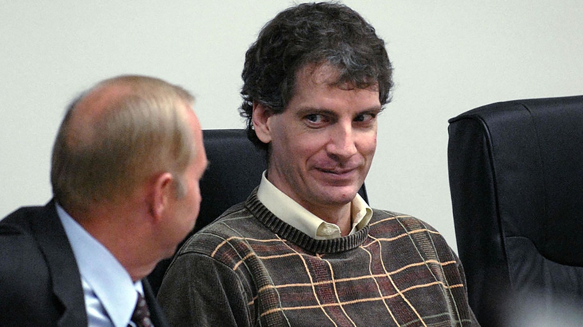 Coeur d'Alene, UNITED STATES: Joseph Edward Duncan III (R), listens to his Public Defender John Adams (L), during a plea agreement and sentencing hearing in the court room of the Kootenai County Jail 16 October, 2006 in Coeur d' Alene, Idaho. AFP PHOTO/POOL/Kathy Plonka (Photo credit should read KATHY PLONKA/AFP via Getty Images)