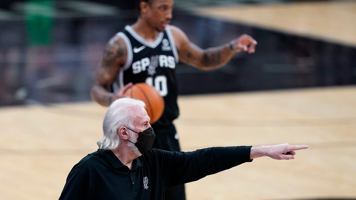 San Antonio Spurs coach Gregg Popovich directs players during the first half of an NBA basketball game against the New Orleans Pelicans in San Antonio, Saturday, Feb. 27, 2021.