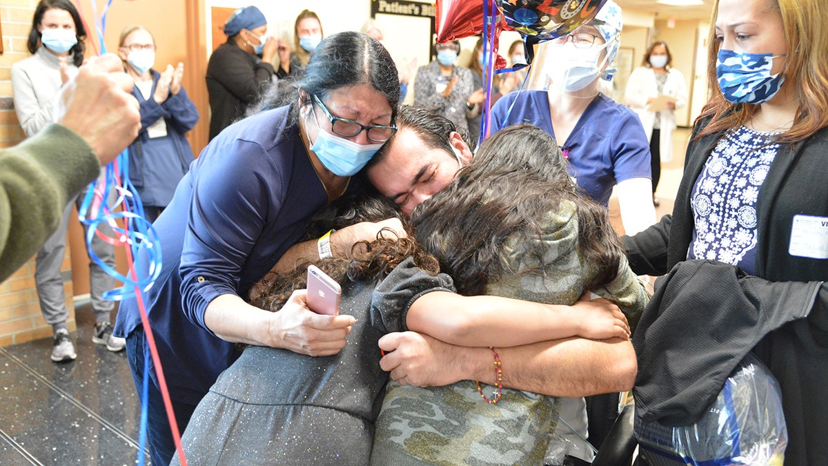 The emotional moment on Tuesday was celebrated by staff who helped care for him during his stay.