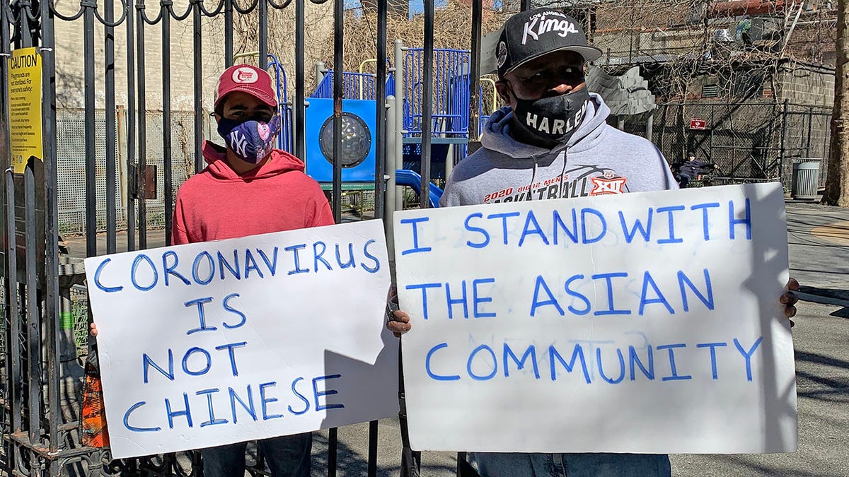 Asian Lives Matter at the scene the day after an Asian woman was attacked in New York City.