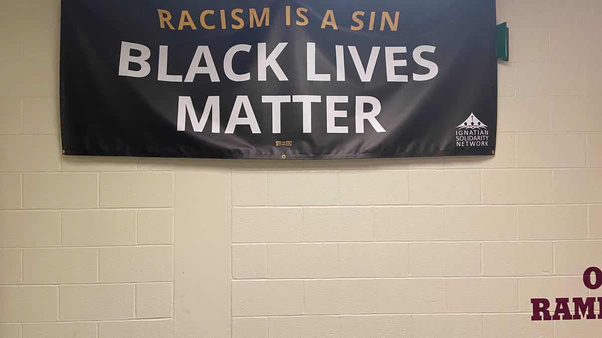 A Black Lives Matter banner that hangs in a hallway at Loyola Academy.