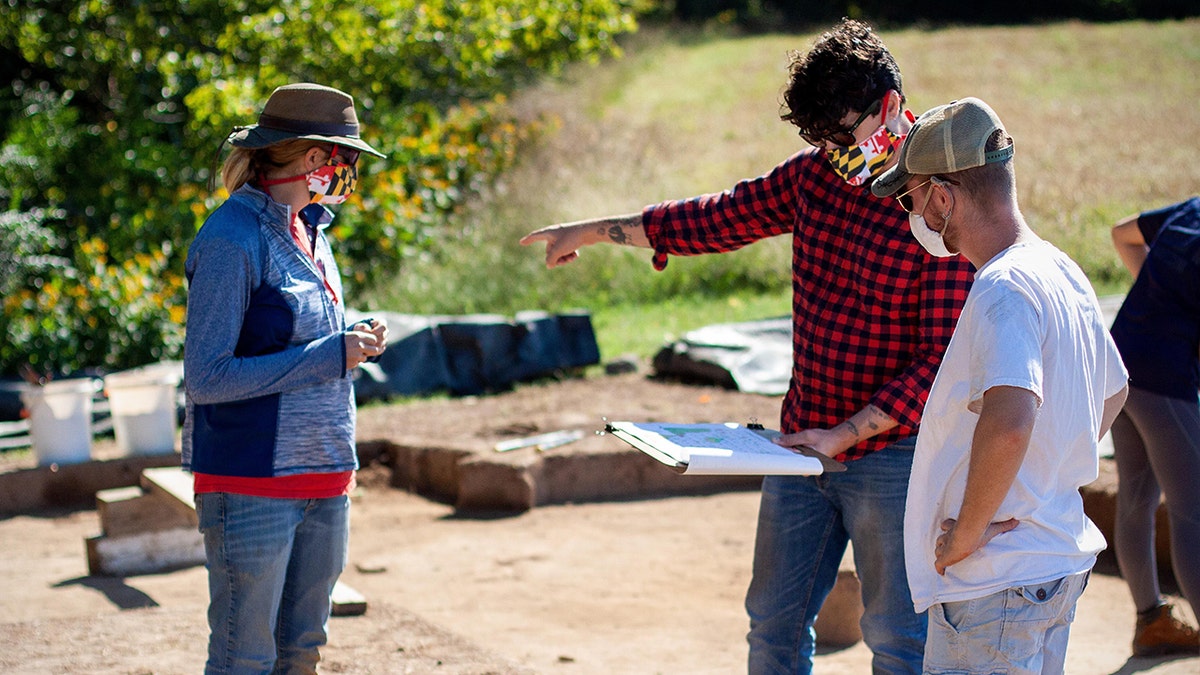 Historic St. Mary’s City archaeologists Stephanie Stevens and August Rowell consult with Director of Research and Collections Dr. Travis Parno (center) at the St. Mary’s Fort dig site (Credit: Historic St. Mary’s City)