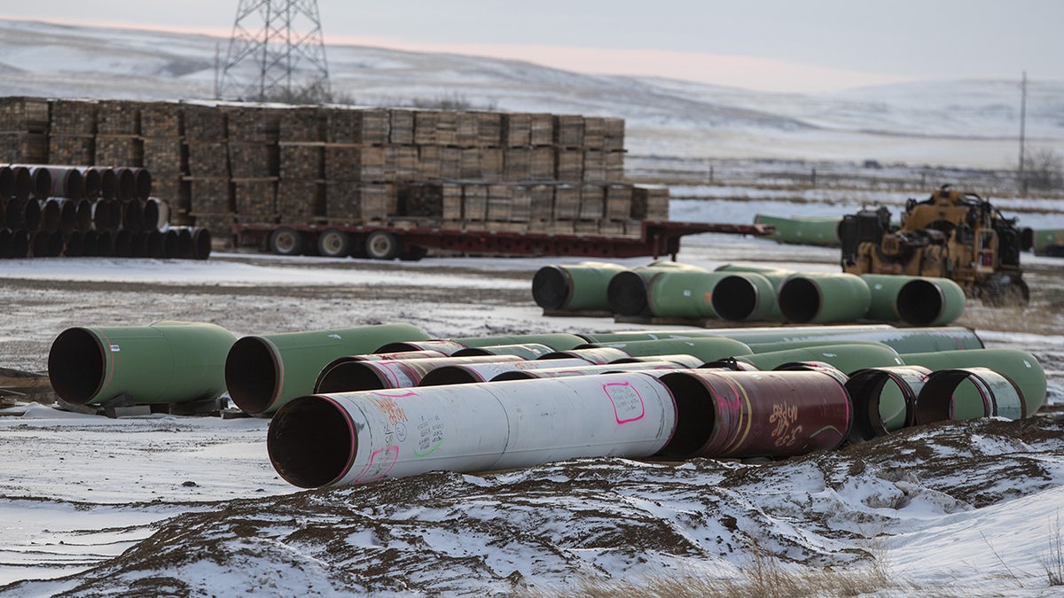Pipes for the Keystone XL pipeline stacked in a yard near Oyen, Alberta, Canada, on Tuesday, Jan. 26, 2021. Photographer: Jason Franson/Bloomberg via Getty Images